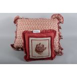 A square cushion, decorated gros point panel of a dog's head, and three larger cushions decorated