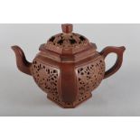 A Chinese Yixing pottery teapot, decorated four pierced panels, impressed mark to base, 5 1/2" high
