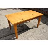 A pine rectangular top kitchen table, on square taper supports, 59" x 33", and a set of four beech