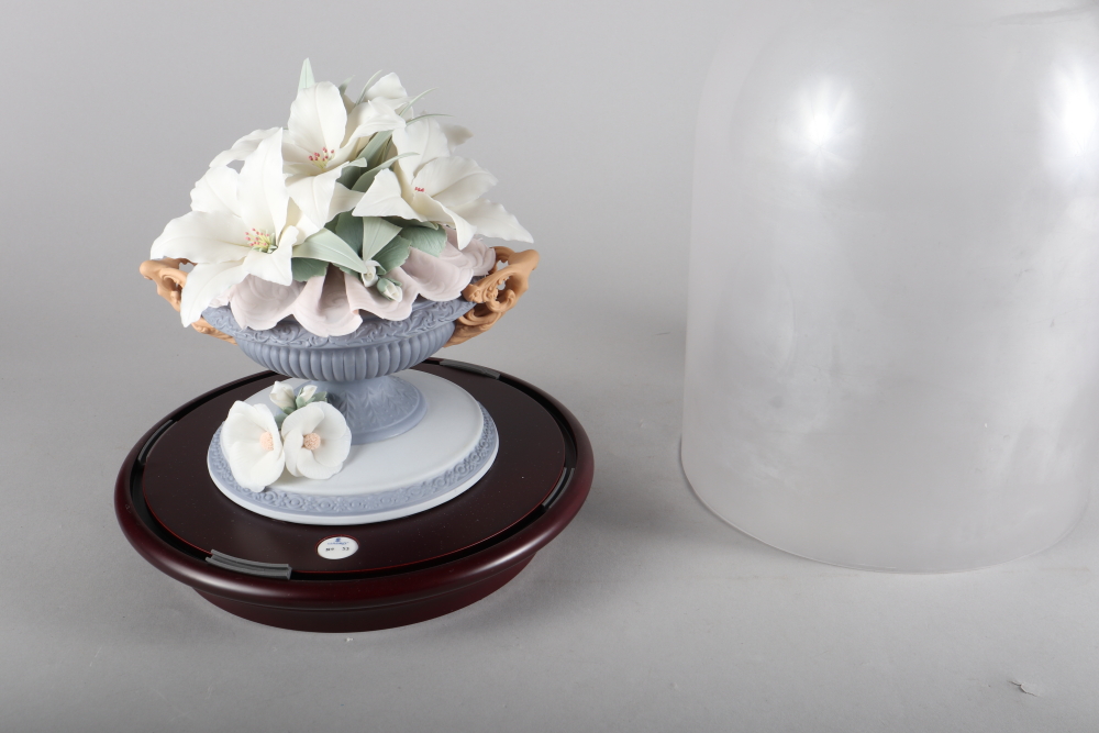 A Lladro porcelain arrangement under a glass dome, "Floral Harmony No 44", 16" high, a similar