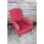 A deep seat arm easychair, upholstered in a scarlet moquette, on turned and castored supports