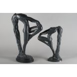 An Austin Sculpture black plaster figure of a nude, "Sultry Awakening", 21" high, and a similar