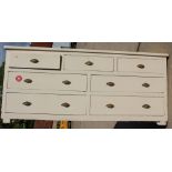 A 19th century white painted pine chest, fitted seven drawers, 77" wide