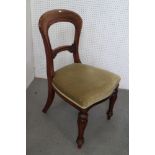 A set of four Victorian carved walnut loop back side chairs, on shaped supports