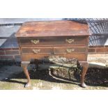 An 18th century crossbanded mahogany lowboy, fitted three drawers, 30" wide