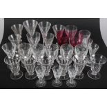 An assortment of 19th century drinking glasses and two cranberry wine glasses
