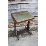 A late 19th century oak fretwork slope top writing desk, on panel end supports, 21 1/2" high x 18"