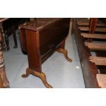 A walnut Sutherland tea table, on panel end supports and cabriole feet, 24" wide, and a three-tier