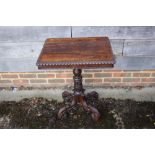A 19th century carved rosewood occasional table, on turned column and quadruple acanthus scroll