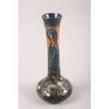 A Moorcroft "Peacock" pattern slender vase, designed by Rachel Bishop, 8 1/4" high