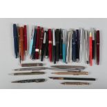 Five Parker pens, various, and a number of other fountain pens, ballpoints, propelling pencils, etc