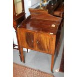 A mahogany tray top commode/bedside stand, on square taper supports, 23" wide x 18" deep x 31 1/2"
