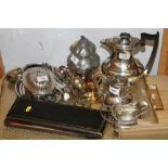 An assortment of silver plate, including loose cutlery, cased fish servers, a coffee pot, a butter