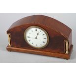 An inlaid mahogany cased mantel clock with white enamel dial and Roman numerals, 5 1/2" high