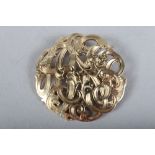 A yellow metal brooch with pierced decoration, stamped 14K, 11.4g