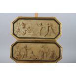 A pair of 19th century trompe-l'oeil oil on panels, putti, 6 1/2" high x 15 3/4" wide, in