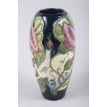 A Moorcroft "Sweet Pea" pattern baluster vase, signed D J Hancock, 7 1/2" high