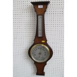 A mahogany cased barometer and thermometer, 28" high, and eight clock weights, various sizes,