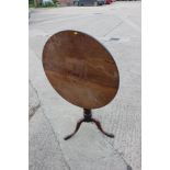 An 18th century mahogany circular occasional table, on tripod base, 30" dia