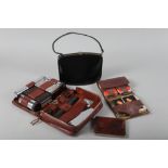 A gentleman's leather cased travelling set, a leather cigarette case showing British Zone Germany, a