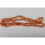 A butterscotch amber necklace, 48" long total, 63.6g