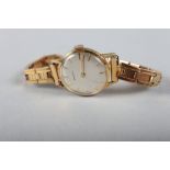 A lady's 18ct gold cased Zenith wristwatch with silvered dial and baton numerals