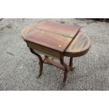 A Victorian mahogany and inlaid flap top work table, on lyre end supports, 33" wide (as found)
