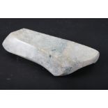 A carved jade "wrist rest", 10" long