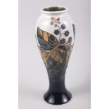 A Moorcroft "Blackberry" pattern vase, 11" high