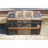 A domed top cabin trunk, 34" wide, a black metal uniform trunk, 35" wide, and two other metal