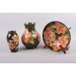A Walter Moorcroft "Hibiscus" pattern baluster vase, 9 1/2" high, a similar bowl, 10 1/2" dia, and a