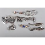 A selection of silver and white metal jewellery, including a marcasite horse brooch, a pair of