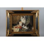 After Henriette Ronner-Knip: a print, "A cat with her three kittens", in ebonised and gilt frame,