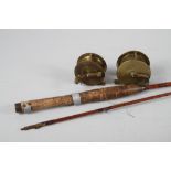 A split cane fishing rod, an Alcock & Co brass reel and one other brass reel