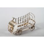 An early 20th century silver plated toast rack, formed as a charabanc