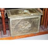 A brass log box with hinged lid and embossed decoration, 27 1/2" wide