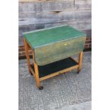 A painted hardwood two-tier tea trolley with flap top, 18" wide x 26" deep x 26 1/2" high
