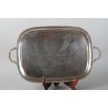 A silver two-handled serving tray with gadrooned border, 112.4oz troy approx