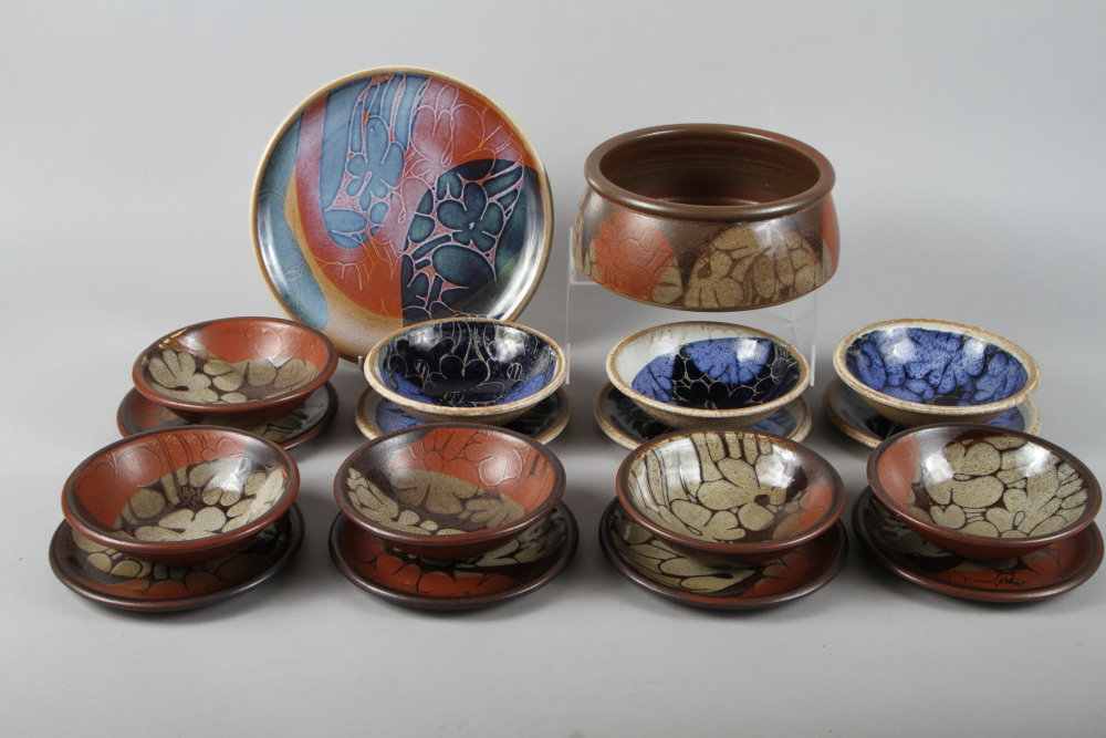C P: a set of five redware bowls with resist glazed decoration, three similar bowls, 6 1/2" dia,