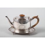 A Georgian style teapot, 8.9oz troy approx, a matched silver plated teapot stand and a Continental