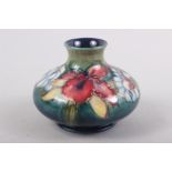 A Moorcroft "Orchid and Spring Flower" pattern squat vase, 3" high