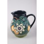 A Moorcroft "Passion Fruit" pattern baluster jug, designed by Nicola Slaney, 6" high