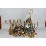 A pair of brass candelabra with fluted column and circular base, 12" high, three similar candelabra,