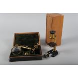 A late 18th century brass travelling microscope, in fitted case (incomplete), and a student's