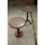 An early 20th century oak circular topped occasional table with turned and carved column, on