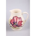 A Moorcroft "Hibiscus" pattern baluster jug, 6" high