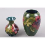 A Moorcroft "Hibiscus" pattern bulbous vase with paper label to base, 5" high, and another similar