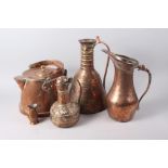 A copper hot water jug by Bullpitt & Sons, a copper coal helmet and four Middle Eastern copper jugs