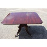 A 19th century mahogany tilt top breakfast table, on turned column and quadruple splay supports with