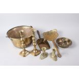 A 19th century cream skimmer, a brass preserve pan, two pairs of candlesticks, a chamberstick and